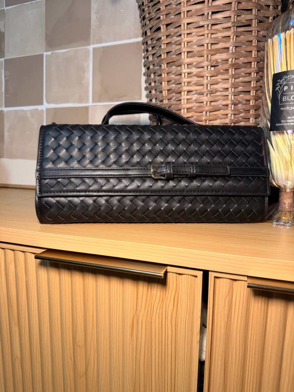 Black woven clutch